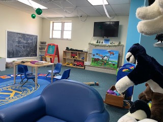 Collinsville Illinois Library kids room with t.v., chalkboards, table, and puppets.