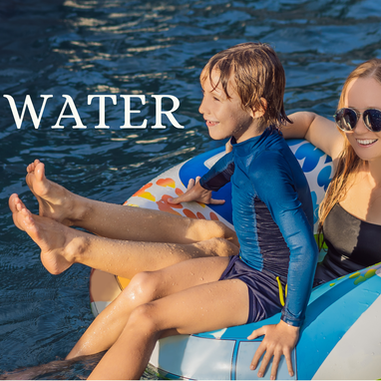 Picture of a woman and child floating on an inner tube in a pool with the word water