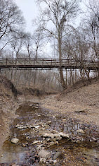 Bridge over shallow creek at Emmeneger Park in Kirkwood, Missouri