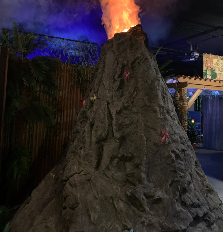 The volcano shoots smoke into the air at Adventures of Intrigue in Saint Louis, Missouri.