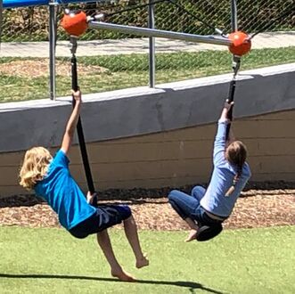 2 kids on swing at O'Day Park (O'Fallon Missouri)