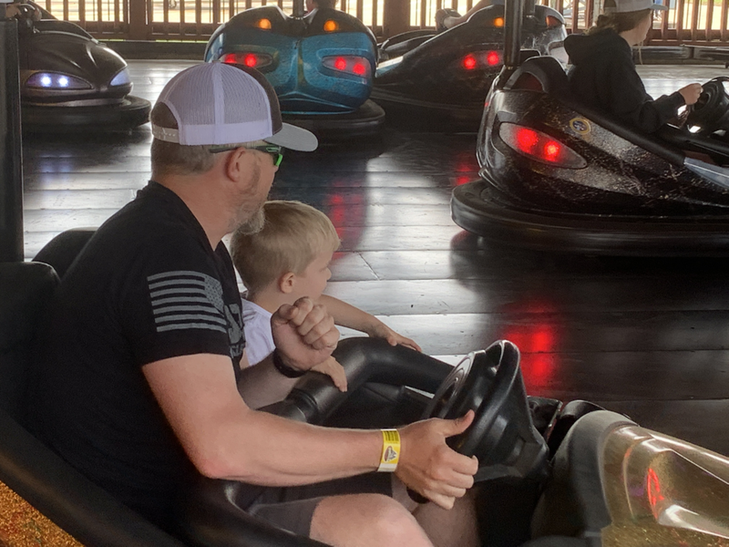 Man and Boy on bumper cars at the Tracks in Branson, IL.