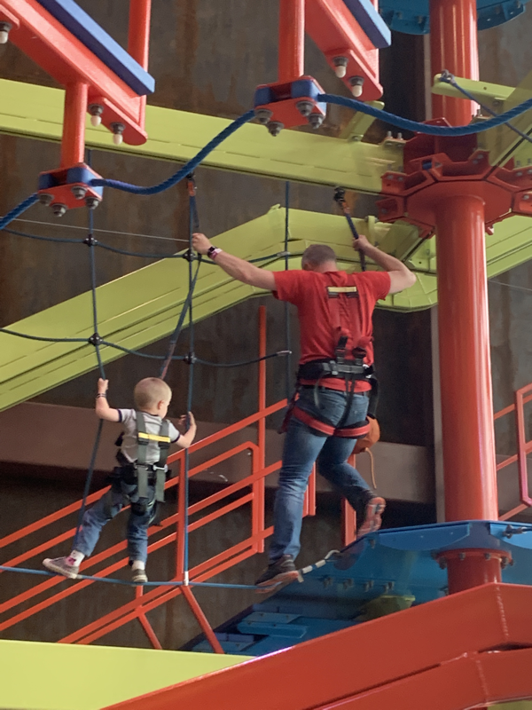 Man and Boy on High Ropes Course in Fritz Adventure in Branson, IL.