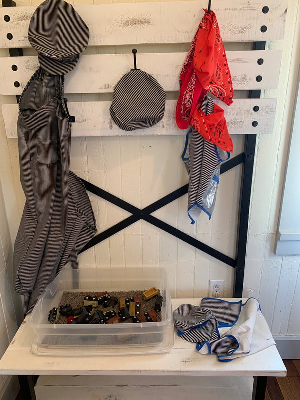 Dress up clothes hanging at Nickle Plate Station in Edwardsville IL. Clothes include conductor caps, a bandana and other items.